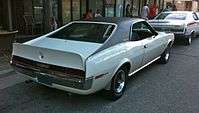 Shows a 1970 AMC Javelin featuring optional full black vinyl covered roof