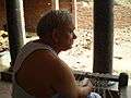 A resident supervises construction of his pucca house in Chandesh.jpg