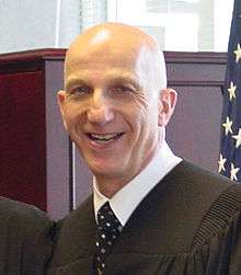 Allan Kornblum at his investiture ceremony in 2003.