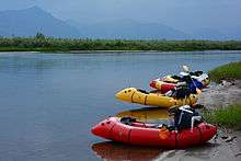 Four Alpacka packrafts on the Anaktuvuk River, in the North Slope region of Alaska