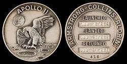  Apollo 11 mission emblem (front). Crew names, dates (launch, lunar landing, and return), and serial number 416 (back)