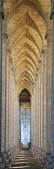 Stone arches reminiscent of a Gothic cathedral.