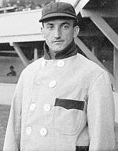 Bobby Wallace in a cap and high-collar coat (black-and-white)