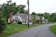 Two-story houses beside a driveway