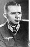 A man wearing a military uniform and neck order in the shape of a cross.