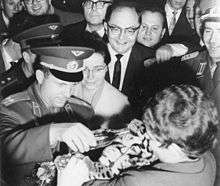 Yuri Gagarin and Valentina Tereshkova feeding a baby tiger.