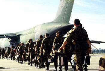 Photograph of Australian soldiers boarding a US Galaxy aircraft for Namibia