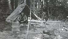 John Leslie Charles in camp during work on the Hudson Bay Railway survey 1914.