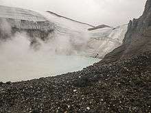 The crater lake at the eastern summit of Copahue Volcano.