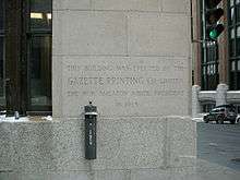 Photograph of building's cornerstone