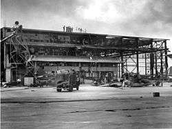 Rafters and wooden structures of a bombed out hangar