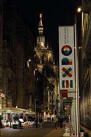 Vertical banner on a city street at night