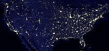 Nighttime satellite image of the contiguous United States showing light pollution in densely populated areas