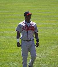 Photograph of Édgar Rentería standing on a baseball field while with the Atlanta Braves.