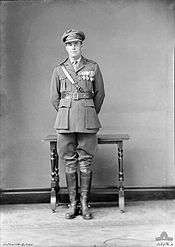 Full length portrait of man in military uniform wearing medals