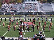 Edinboro University Pipers with Marching Band at Football Homecoming