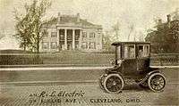 Advertising postcard (pre-1906) for the R&L Electric Car taken in front of the Leonard Hanna mansion on Euclid Avenue