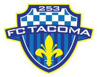 A blue striped and checkered shield is adorned with the words "FC TACOMA" across the middle and "253" across the top. And below is a yellow Fleur-de-lis.