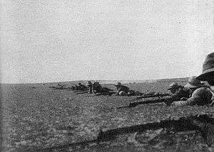 Line of dismounted soldiers with bayonets attached to rifles in the firing line