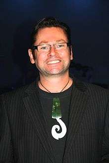 A man in his 40s wearing a Pounamu pendant