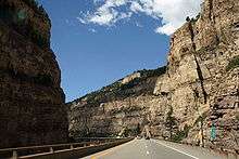 A railroad, river and two-tiered highway following a narrow canyon