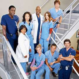 A photo of the Grey's Anatomy characters in surgical scrubs