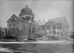 Large building with windows and part of roof missing