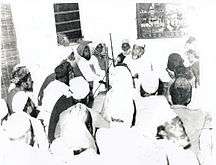 Moulana Peer Sahvi Shah delivering speech