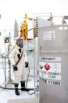  A suited worker looks over the hydrazine fuel supply to be loaded in MESSENGER.