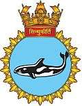 Submarine crest with a large, black-and-white fish