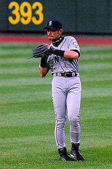 Ichiro Suzuki fielding a ball in the outfield as a Seattle Mariner