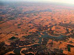 Salmonie Lake in the foreground, with the town of Huntington, Indiana to the left background