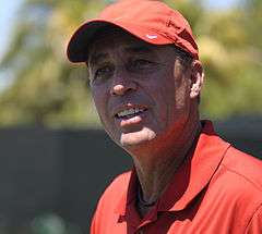 A man in a red hat and red shirt