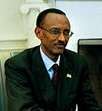 Kagame wearing a suit and Rwandan flag badge during a meeting with American President George W. Bush