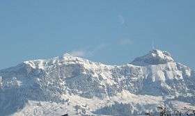 Picture showing snow covered mountains against a clear blue sky