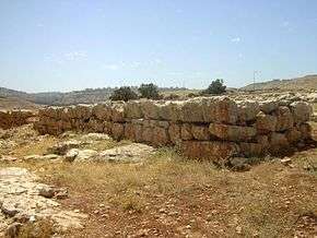 Colored photograph showing a rectangular stone structure