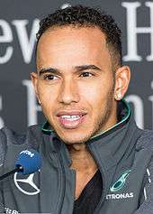 A picture of Lewis Hamilton donning Mercedes Grand Prix attire.