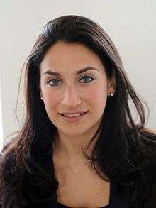 Photographic portrait of a young woman with long dark hair