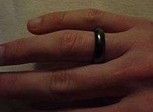 A smooth circular band of magnetite on a finger