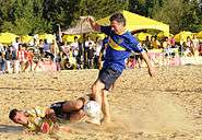 Macri taking part in a friendly match of beach soccer, 2011.