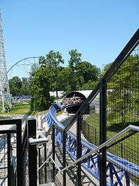 Roller coaster train coming out of a tunnel