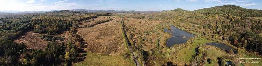 Panoramic image taken from a drone at an altitude of approximately 200 meters in September, 2014. Facing north, this shows the western side of Battle Mountain and Little Battle Mountain on the right, with Aaron mountain visible on the left. The Blue Ridge Mountains of Shenandoah National Park are visible on the horizon.