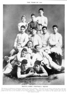 A group of men posing for a picture while wearing sweaters