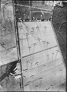 Aerial view of fields covered in abandoned gliders