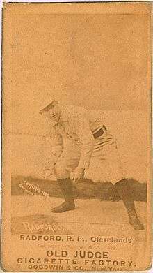 A picture depicting a baseball player who is holding a ball with his right hand, and is crouched as if he is ready to throw it