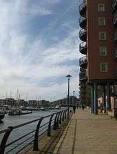 New apartments blocks with boats moored in the marina.