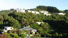 Photo of Raphael House Rudolf Steiner School in Belmont, Lower Hutt from the road that runs below.