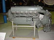 A left side view of a gloss grey -painted aircraft piston engine on static display