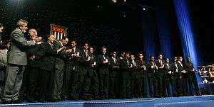 An association football team being congratulated by delegates from São Paulo.