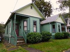 Photograph of a single-story duplex house